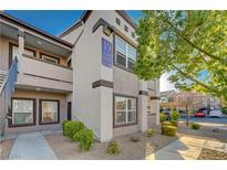 Two-story building exterior with walkway and landscaping at 7255 W Sunset Rd # 1140, Las Vegas, NV 89113