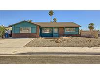 Charming single-story home featuring a unique exterior and a desert landscaped front yard at 425 Oil Lantern Ln, Las Vegas, NV 89145