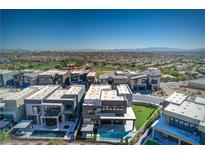 Luxury homes with pools and manicured lawns offer a contemporary style of living with mountain views at 5429 Succulent Rose Dr, Las Vegas, NV 89135