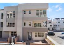 Modern three-story townhome with a two-car garage and private balcony at 655 Spotted Falcon St, Las Vegas, NV 89138