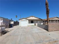 Charming single-story home with a convenient driveway and a cozy front yard, perfect for a small Gathering at 1929 Evelyn Ave, Henderson, NV 89011
