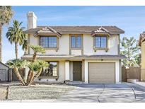 Two-story house with attached garage and landscaping at 108 Almendio Ln, Henderson, NV 89074