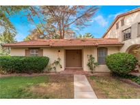 Charming single-story home with a red tile roof, a well-maintained lawn, and mature landscaping at 3125 Pinehurst Dr # A, Las Vegas, NV 89109