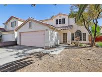 Two-story house with pink garage door, landscaping, and driveway at 1712 Orchard Valley Dr, Las Vegas, NV 89142