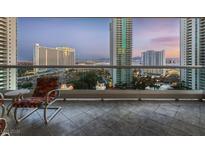Enjoy stunning city views from this condo balcony with comfortable seating and tile flooring at 2747 Paradise Rd # 1505, Las Vegas, NV 89109