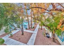 Inviting community pool area with walkways and landscaping at 4960 Harrison Dr # 214, Las Vegas, NV 89120