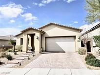 Charming single-story home featuring a low-maintenance yard and a two car garage at 44 Strada Caruso, Henderson, NV 89011