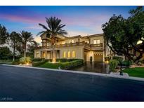 Luxury two-story home with palm trees and a large driveway at 2200 Glenbrook Way, Las Vegas, NV 89117