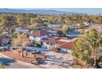 Stunning home with red tile roof, lush landscaping, and city views in a desirable neighborhood at 2868 Vista Del Sol Ave, Las Vegas, NV 89120