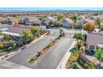 Aerial view of community entrance and homes with mountain views at 5912 Sea Hunter St, North Las Vegas, NV 89031