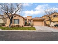 Charming single-story home featuring a two-car garage, desert landscaping, and a private courtyard entry at 4996 Del Pueblo Ave, Las Vegas, NV 89141