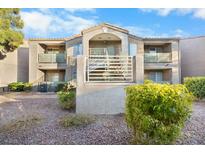 Two-story building exterior with landscaping and balconies at 2130 Sealion Dr # 207, Las Vegas, NV 89128
