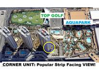 Aerial view of a luxurious resort condo with nearby pool and golf course at 145 E Harmon Ave # 1001, Las Vegas, NV 89109