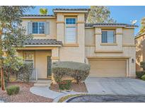 Charming two-story home featuring a two-car garage, landscaped front yard, and neutral stucco exterior at 2731 Heathrow St, Las Vegas, NV 89135