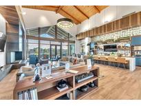 Bright and spacious community center with comfortable seating, fireplace, and kitchen at 2043 Arrington Ave, North Las Vegas, NV 89086