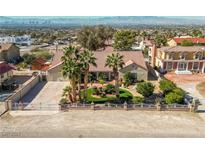 Expansive ranch style home featuring a tile roof, mature landscaping, and a circular driveway at 485 Sari Dr, Las Vegas, NV 89110