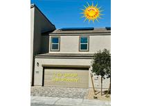 Two-story home featuring a two-car garage with solar panels at 6680 Nimbus Ave # Lot 20, Las Vegas, NV 89130