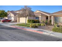 Charming single-story home featuring a well-manicured front yard and an attached two-car garage at 7936 Pinnochio Ave, Las Vegas, NV 89131