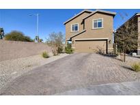Two-story house with a paved driveway and landscaped front yard at 3506 Judson Ave, Las Vegas, NV 89115