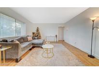 Inviting living room with a large sectional sofa, soft carpet, and plenty of natural light at 1420 Vegas Valley Dr # 18, Las Vegas, NV 89169