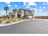 Modern two-story home with neutral exterior and landscaped front yard at 4008 Desert Trace Ct, Las Vegas, NV 89129