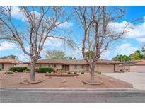 Charming single-story home with desert landscaping and mature trees at 3690 S Rosecrest Cir, Las Vegas, NV 89121