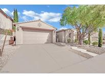 Single-story house with attached garage and landscaped front yard at 952 Contadero Pl, Las Vegas, NV 89138