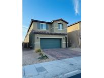 Two-story home featuring a two-car garage, low maintenance yard, and neutral color palette at 8279 Palladium St, Las Vegas, NV 89113