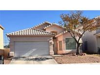 One-story house with attached garage and desert landscaping at 3456 Beca Faith Dr, North Las Vegas, NV 89032