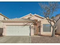 One-story house with a two-car garage and desert landscaping at 3456 Beca Faith Dr, North Las Vegas, NV 89032