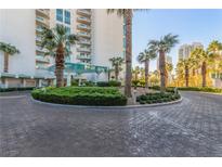 Building exterior with palm trees and circular driveway at 322 Karen Ave # 505, Las Vegas, NV 89109