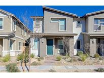 Two-story home with a teal door and landscaped front yard at 712 Cottonwood Hill Pl, Henderson, NV 89011