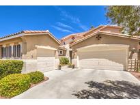 Two-car garage, attractive landscaping, and a charming facade at 1590 Sabatini Dr, Henderson, NV 89052