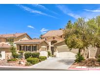 Charming home with three-car garage, tile roof, and beautiful desert landscaping at 1590 Sabatini Dr, Henderson, NV 89052