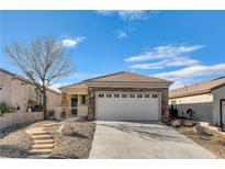 Single-story home with stone accents and a two-car garage at 2601 Darda St, Henderson, NV 89044