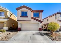 Inviting two-story home features desert landscaping and an attached two-car garage at 4788 Frankfurt Ct, Las Vegas, NV 89147