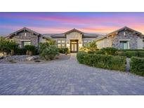 Stunning single-story home with stone accents and landscaped front yard at 4160 W Ford Ave, Las Vegas, NV 89139
