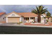 Charming single-story home with desert landscaping and a welcoming entrance at 8516 Spyrun Dr, Las Vegas, NV 89134