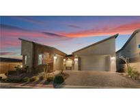 Modern two-story home with attached two-car garage and landscaped front yard at 16 Via Stefano, Henderson, NV 89011