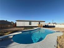 Inviting backyard with a sparkling pool and diving board at 2028 College Pl, Las Vegas, NV 89156