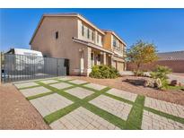 Two-story house with a large driveway and RV gate at 5728 Collier Falls Ave, Las Vegas, NV 89139