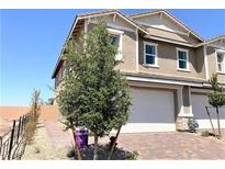 Two-story house with attached garage and landscaping at 112 Antler Square Ln, Henderson, NV 89011