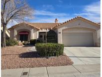 Single-story home with landscaped yard, two-car garage, and attractive curb appeal at 3020 Ripon Dr, Las Vegas, NV 89134