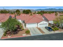 Attractive single-story home with two-car garage, desert landscaping, and mountain views at 5683 Whale Watch St, Las Vegas, NV 89113