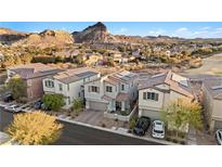 Aerial view of a house community with mountain backdrop at 23 Papavero Ct, Henderson, NV 89011