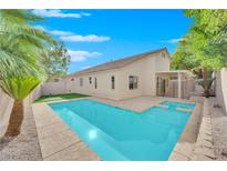 Inviting backyard oasis featuring a sparkling pool and spa at 7832 Red Leaf Dr, Las Vegas, NV 89131