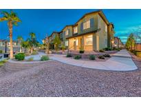 Charming two-story townhome with well-manicured landscaping and a welcoming entrance at 965 Nevada State Dr # 1101, Henderson, NV 89002