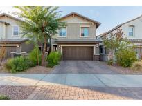 Charming two-story home with well-maintained landscaping and a two-car garage at 361 Andy Wheeler Dr, Henderson, NV 89011