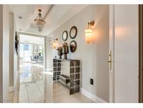 Elegant hallway features a crystal chandelier, sconces, and stylish decor at 2747 Paradise Rd # 2206, Las Vegas, NV 89109