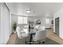 Bright dining room featuring modern glass table, seating for six, neutral walls, and natural light at 538 Kristin Ln, Henderson, NV 89011